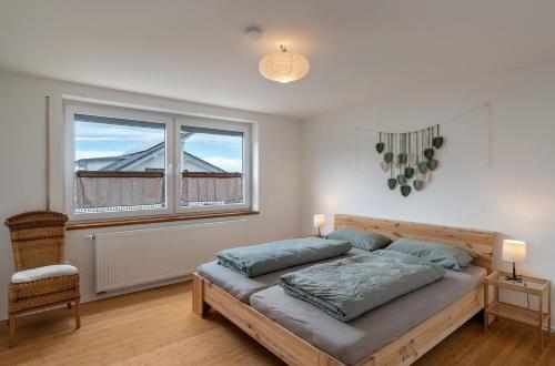 a bedroom with a bed and a window at Haus Elisabeth in Lauf