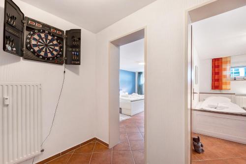 a room with a dart board on the wall at Wellness Ferienwohnung Strandperle in Cuxhaven