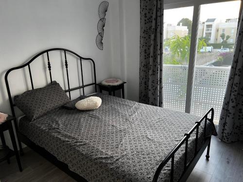 a bedroom with a bed and a window with a view at Rodalia in El Verger