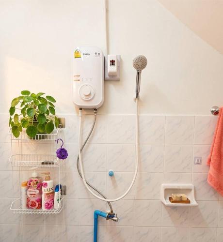 a bathroom with a shower with a shower at Hug Pai Garden City Retreat in Pai