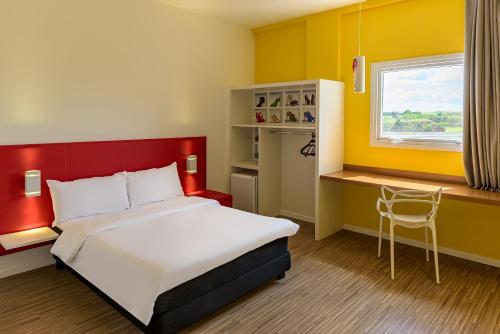 Postel nebo postele na pokoji v ubytování ibis Styles Birigui