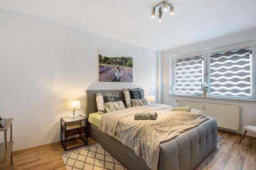 a bedroom with a large bed and a window at Ferienwohnung San Marino 2 in Mücheln