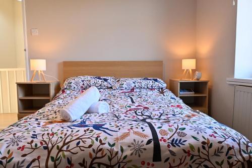 a bed with two pillows on it in a bedroom at 7 Western Hill in Frosterley