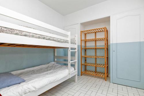 a bedroom with two bunk beds and a closet at La Baule in La Baule
