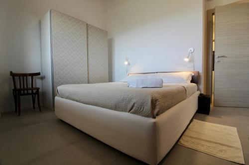 a bedroom with a large white bed in a room at Amazing Assisi in Assisi
