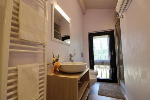 a bathroom with a sink and a toilet at Amazing Assisi in Assisi