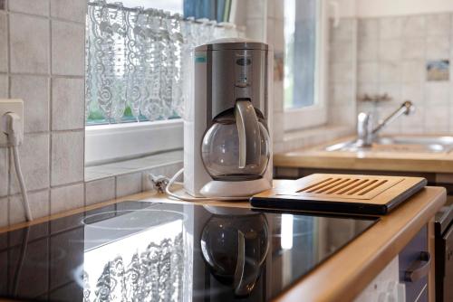 a coffee maker on a counter in a kitchen at Landhaus Peenemünde in Peenemünde