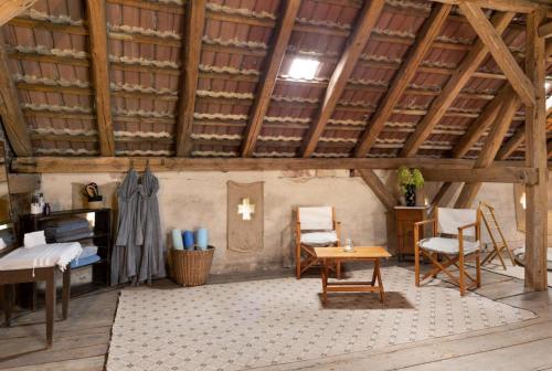 an attic room with a cross on the wall at Apartments-Schlamau19 in Schlamau