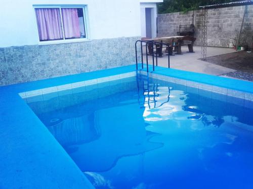 Bazén v ubytování Hostal Benjamin nebo v jeho okolí
