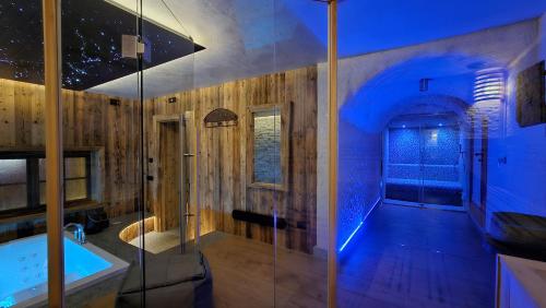 a bathroom with a shower and a bath tub at Le Chalet Suite Livigno in Livigno