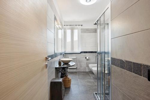 a bathroom with a sink and a toilet at Villa Lice - Coronata in Casarza Ligure