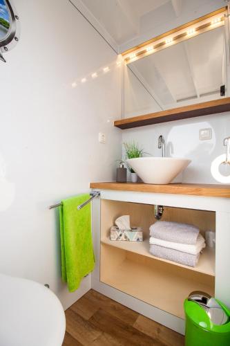 a bathroom with a sink and a counter with towels at Lisa Boot 3 in Priepert