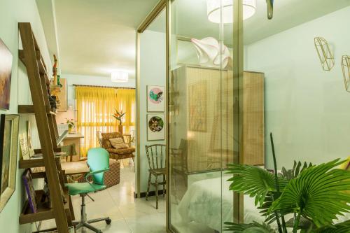 a living room with a glass wall at Flamingo Rosa in Arinaga