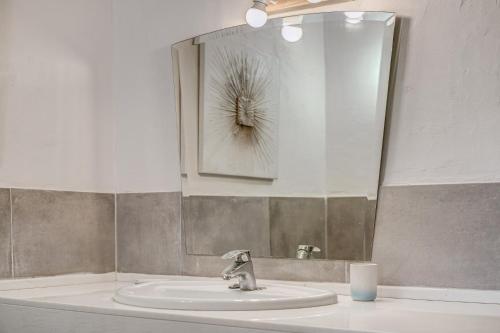 a bathroom with a sink and a mirror at Son del Rio Vell in Pollença