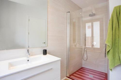 a bathroom with a sink and a shower at Casa Sant Sebastia in Pollença