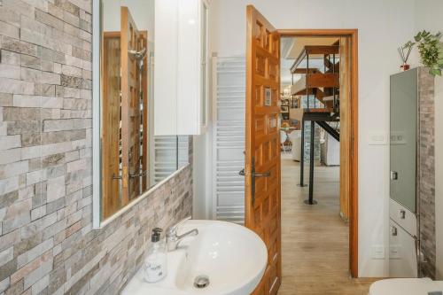 a bathroom with a sink and a mirror at El Cedro in Abejar