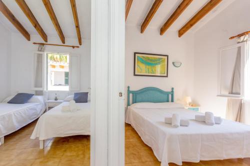 a bedroom with two beds in a room at Son Xoriguer 5 in Son Xoriguer