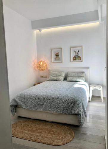 a bedroom with a bed in a white room at Sofias House Fresh And Comfy in Naxos Chora