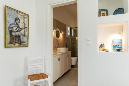 a bathroom with a toilet and a sink at Afroditi Ftelia Anemone in Mykonos