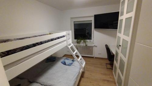a bedroom with a bunk bed and a window at Ferienhaus Kesper in Schottwien