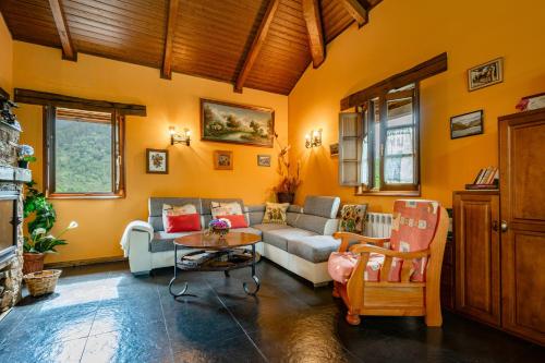 a living room with a couch and a table at Maseda 1 in Villayón