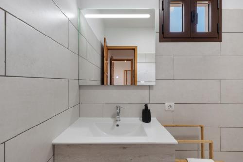 a bathroom with a sink and a mirror at Casa Tajinaste in Tijarafe