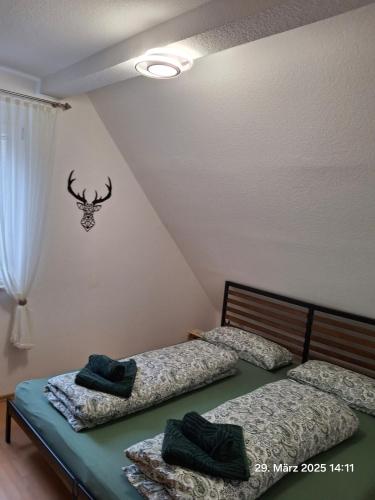 two twin beds in a room with a attic at Im Grünen 2 in Weil der Stadt
