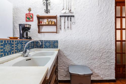 a bathroom with a sink and a toilet at Villa Monbijou in Vinarós
