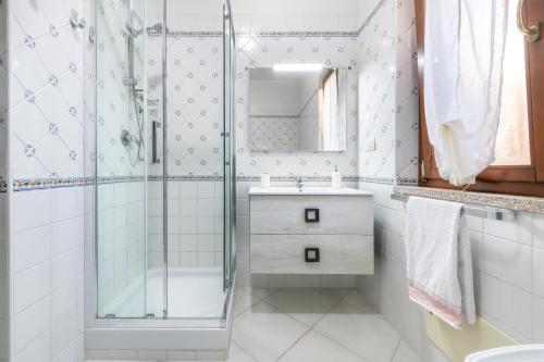 a bathroom with a shower and a sink at Casa Celeste in Villasimius