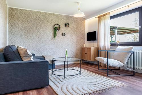 a living room with a couch and a table at Ferienwohnung Reichle in Stockach