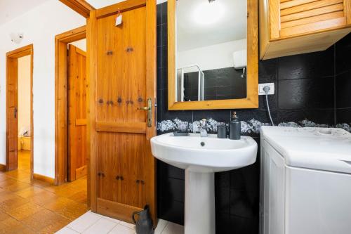 a bathroom with a sink and a mirror at Villa Costa Paradiso del Sud in Costa Rei