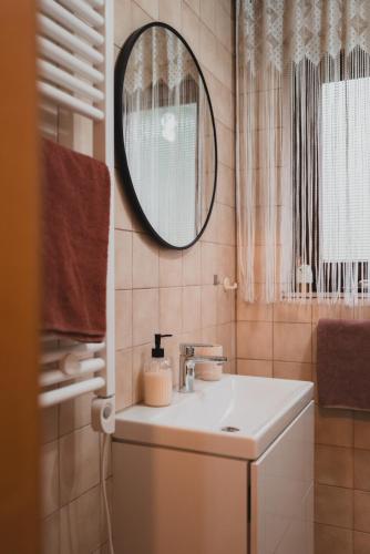 a bathroom with a sink and a mirror at Ferienwohnungen Bullau - 2 in Erbach