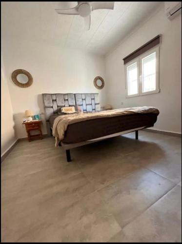 a bedroom with a large bed in a room at Sam in San Fulgencio
