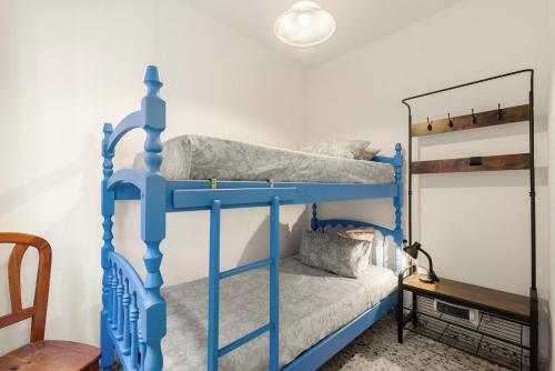 a bedroom with two bunk beds in a room at Casa Coral Beach in Málaga