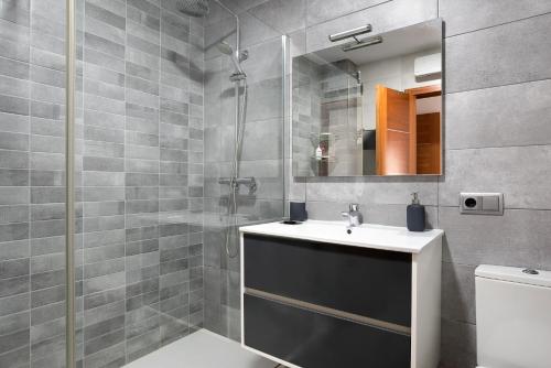 a bathroom with a sink and a shower at Reina's in Vejer de la Frontera