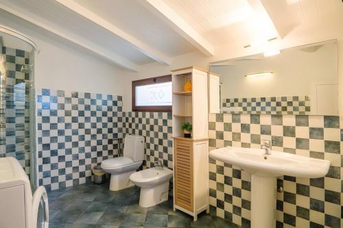 a bathroom with a sink and a toilet at Villetta Antonia in Marina di Andora