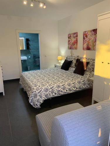 a bedroom with two beds in a room at Beach Bungalow in Torrox