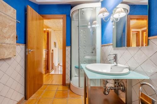 a bathroom with a sink and a shower at The Maisonette Sierra Nevada in Monachil