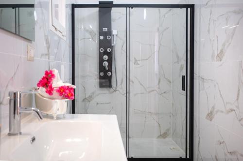 a bathroom with a sink and a shower at Suite Biancolino in Nardò