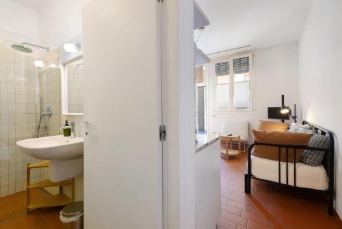 a bathroom with a sink and a toilet in a room at U Canetta 1 in Pietra Ligure