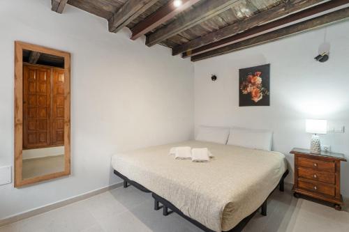 a bedroom with a bed with two towels on it at La Generosa in Arona