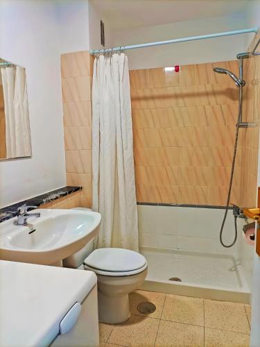 a bathroom with a toilet and a sink at Casa Marazul in Playa Fañabe