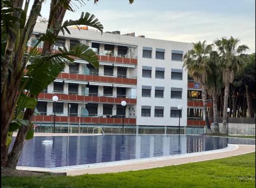 a building with a swimming pool in front of a building at Samitier in Cambrils