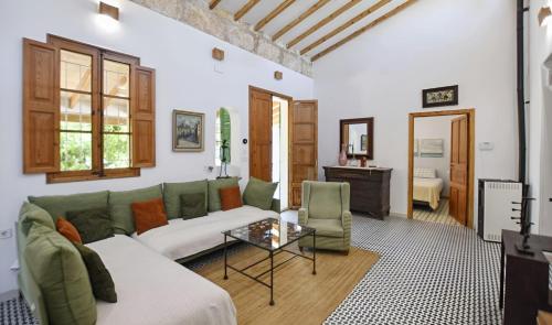 a living room with a couch and a table at Valls in Montuiri
