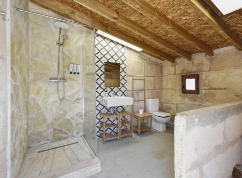 a bathroom with a shower and a toilet at Valls in Montuiri