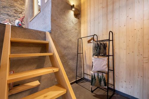 a staircase in a room with wooden walls at Chalet Al Volt in Tremosine Sul Garda