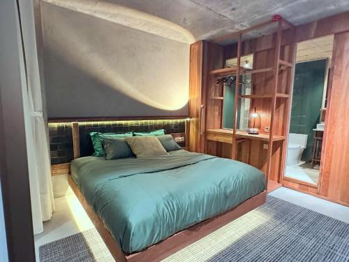 a bedroom with a large bed in a room at Chum Home - 02 in Danang