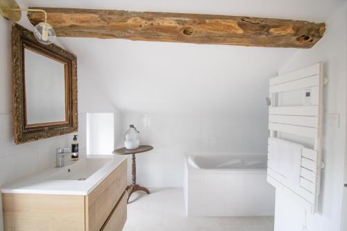 a bathroom with a sink and a mirror at A Casa D'amore in Bastelica