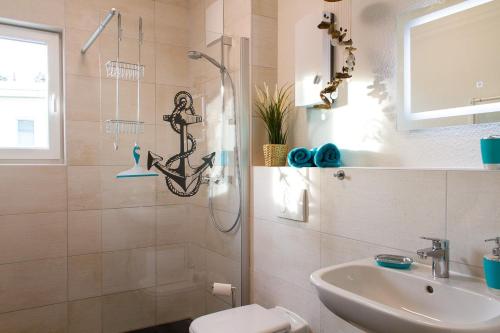 a bathroom with a shower and a sink at Lieblingsinsel in Graal-Müritz