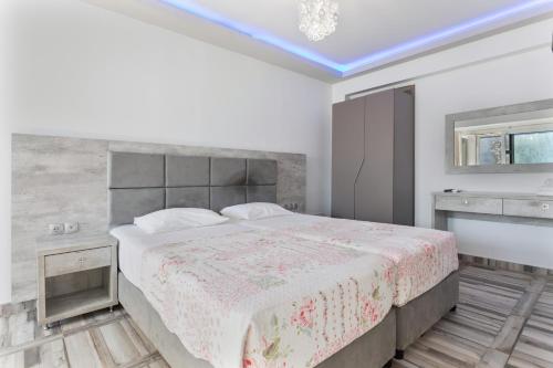 a bedroom with a large bed in a room at Villa Dionysia Studio S3 in Alikanas